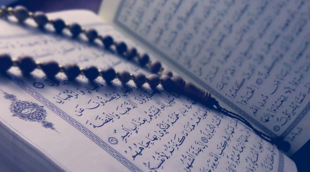 monochrome photo of quran