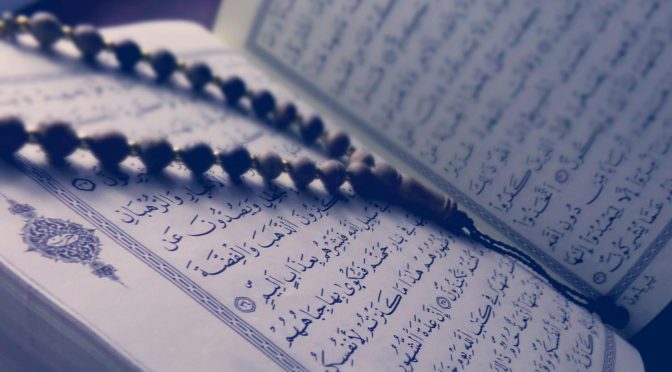 monochrome photo of quran