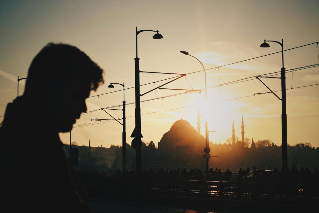 a person in a city at sunset