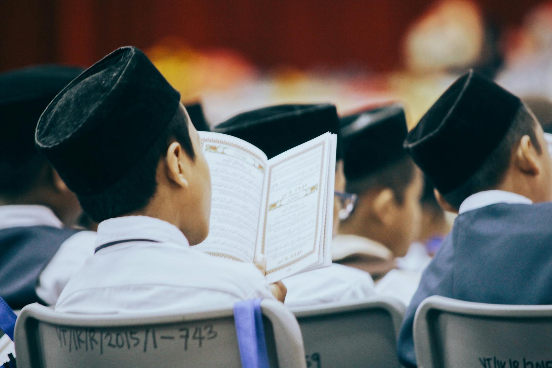 photo of person reading quran