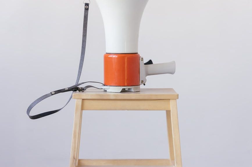 loudspeaker on top of wooden stool