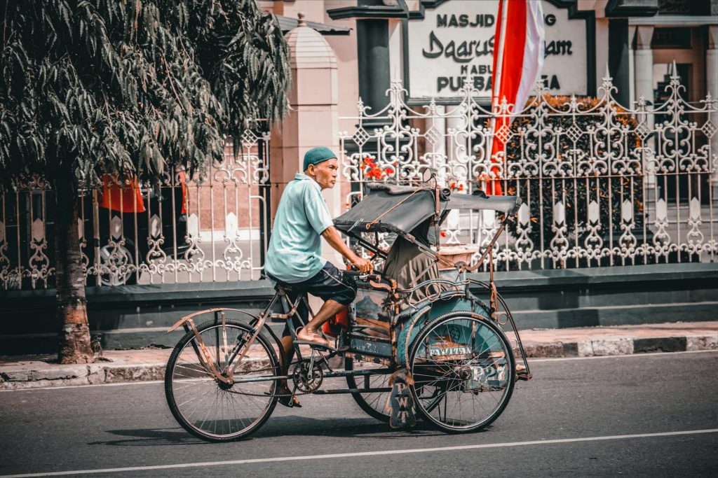 a man riding a tricycle
