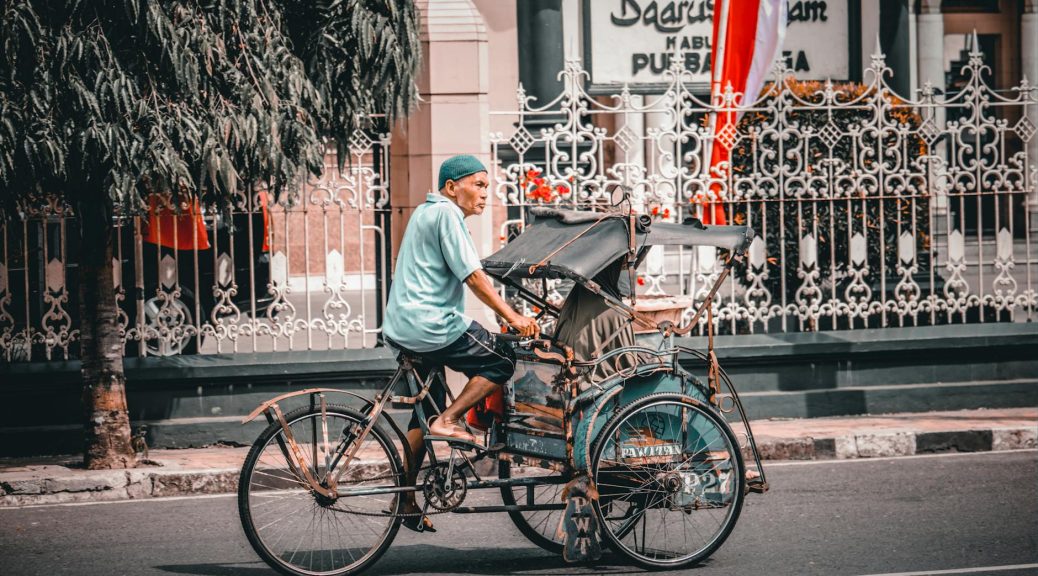 a man riding a tricycle