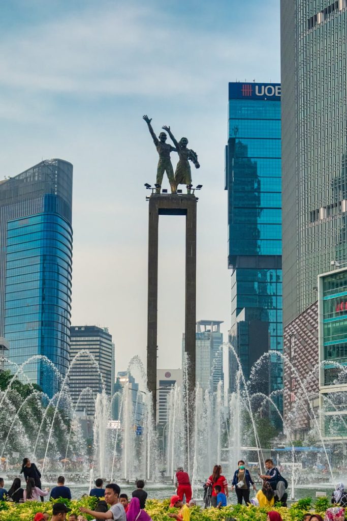 photo of people standing near water fountain