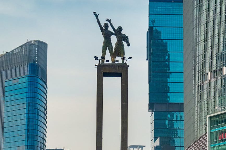 photo of people standing near water fountain